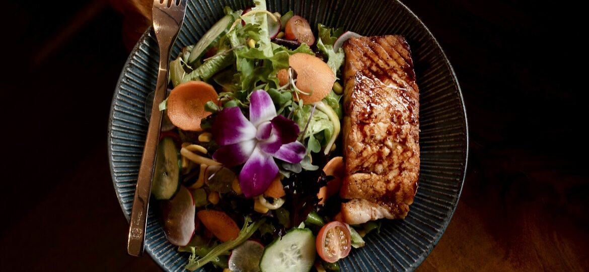 gourmet fish and salad with edible flowers