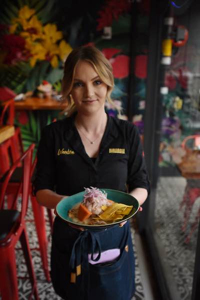 Warike Restobar meal being carried by waitress.