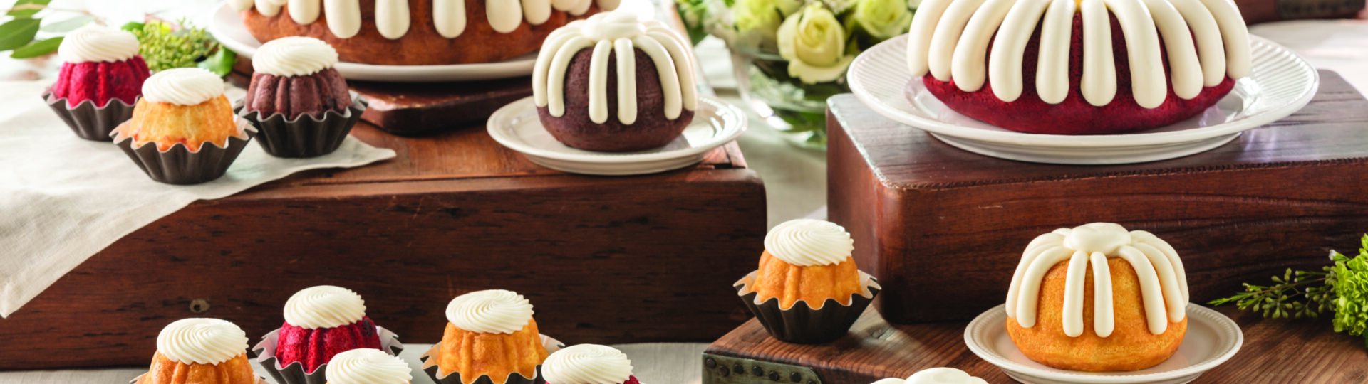 Bundt cakes nicely displayed with icing.