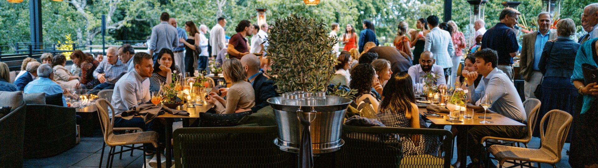 Roof 106. Diners enjoying rooftop dining experience.